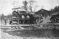 A Camp Lee CCC truck loaded with a bulldozer.