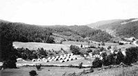 Wide angle shot of Camp Hardy when only tents were available.