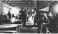 Inside one of the barracks. A large coal burning furnace provided heat in the Winter.