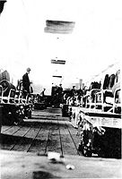 Inside look at one of the barracks at Camp Watoga.  Note the recessed ceilings which suggest a still later time of this photo.  Most barracks were constructed initially with open, exposed rafters. Later, after initial construction, housing refinements were gradually added to barracks in all or most camps around the state during nonscheduled work times - weekends or periods of inclement weather.